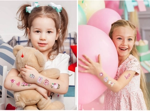 Detail of colorful glitter temporary tattoos featuring strawberry and heart motifs for parties