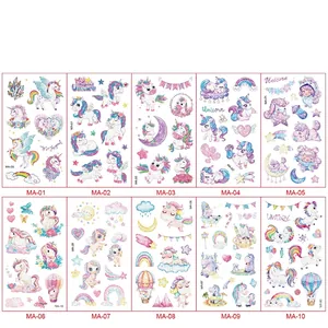 Detailed set of 10 glitter unicorn temporary tattoos with rainbows and stars for kids