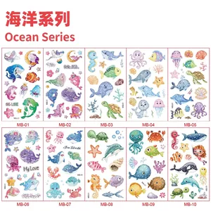 Macro view of ocean themed cartoon temporary tattoos with colorful glitter details