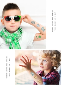Detailed view of colorful glitter cartoon tattoos on children's arms for festive events