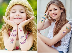 Close-up of colorful butterfly and hummingbird glitter temporary tattoo stickers on skin