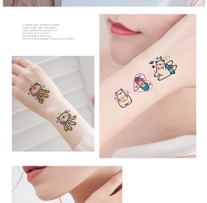 Detail showing waterproof cartoon temporary tattoos with bear and astronaut designs