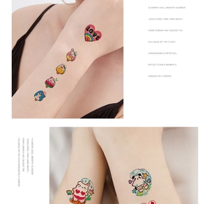 Close-up of waterproof cartoon temporary tattoos with heart and panda designs on skin
