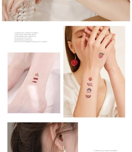 Detailed view of colorful strawberry, heart, and rainbow cartoon temporary tattoos