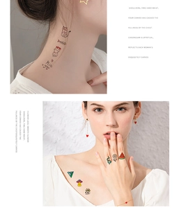 Detail view of cute cartoon and geometric waterproof temporary tattoos on skin