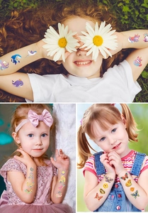Detailed view of colorful laser gold temporary tattoos with ocean and animal themes