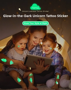 Luminous unicorn temporary tattoos glowing in a cozy night tent for kids