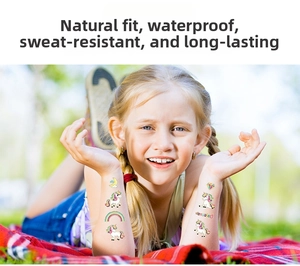 Waterproof laser gold unicorn temporary tattoos for kids shown on a child's arm in a park