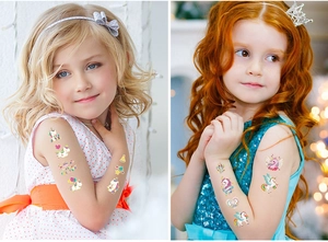 Close-up of children's colorful unicorn temporary tattoos with rainbow and heart patterns