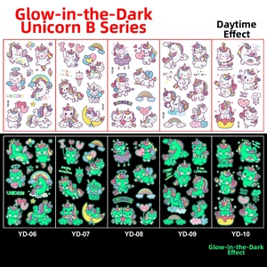 Glow in the dark unicorn temporary tattoos showing day versus night fluorescent effects