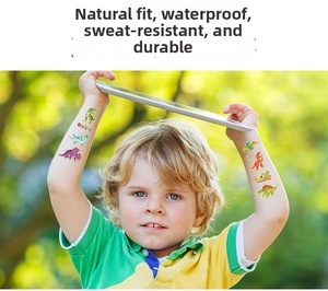 Close-up of waterproof laser gold dinosaur cartoon temporary tattoos on child's arm