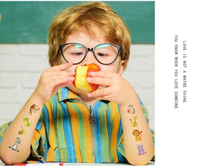 Detail of colorful animal temporary tattoos for kids featuring lion and monkey designs