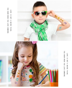 Detail of colorful laser gold cartoon animal temporary tattoos on children's skin