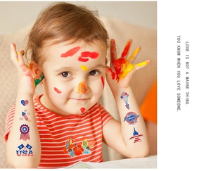 Detail of USA Independence Day temporary tattoos applied on a child's face and arm