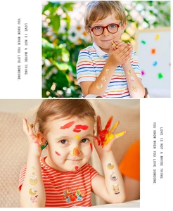 Detail of colorful children's temporary tattoos featuring cute cartoon moon and cat designs