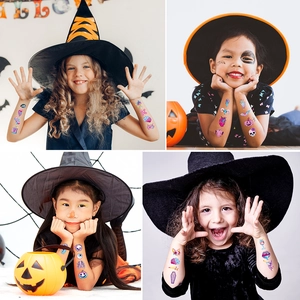 Glitter Halloween temporary tattoo set for kids featuring pumpkin and cartoon spooky designs