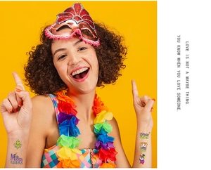 Detail showing Mardi Gras temporary tattoos on a model with festive mask and colorful garland