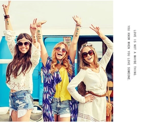 Colorful hippie peace temporary tattoos displayed on models at a summer outdoor festival