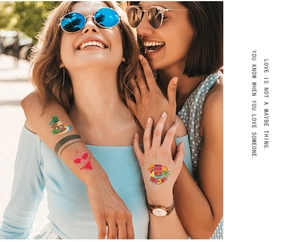 Vibrant Hawaiian temporary tattoos featuring Tiki masks and pineapple patterns on skin