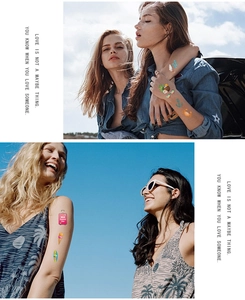 Detail of colorful waterproof temporary tattoos featuring sun and beach summer designs
