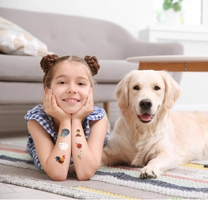 Girl and dog with farm animal temporary tattoos including turkey and rooster designs