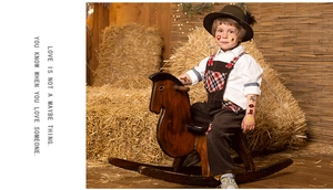 Cowboy themed temporary tattoos for kids showing boots and horse designs on a boy arm