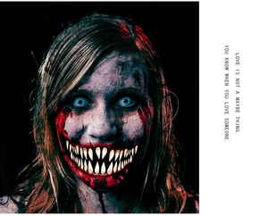 Close-up of Halloween monster mouth tattoo sticker with realistic blood and teeth details