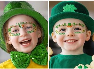 Kids wearing St. Patrick's Day shamrock face tattoos and festive green party accessories