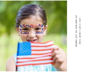 Girl wearing American flag face tattoos with stars and stripes for July 4th party
