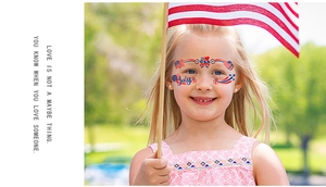 Close-up of USA flag facial tattoos and heart designs for Independence Day celebration
