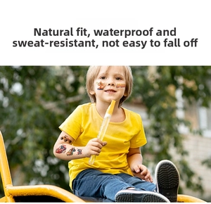 Waterproof racing tattoos for kids featuring cars and flags on a boy's arm and face