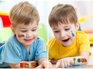 Close-up of cute sanitation truck and worker temporary tattoos applied on children's skin