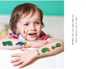 Close-up of cute garbage truck temporary tattoos on a child's arm and cheek for kids