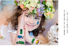 Detail of girl wearing eco-friendly sanitation truck and recycle bin tattoo stickers