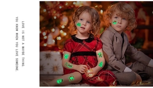 Glow-in-the-dark Christmas temporary tattoos with Santa and snowman patterns on kids