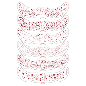 Detailed sheet showing 6 red temporary freckle tattoo designs with hearts and stars
