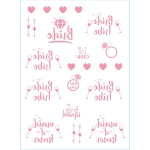 Close-up of rose gold Bride Tribe temporary tattoos with heart and diamond ring icons
