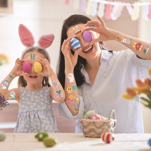 Easter temporary tattoos featuring cartoon rabbits and colorful eggs on mother and daughter