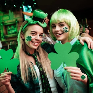 Models wearing green bob wigs and shamrock headbands for St. Patrick's Day party outfits