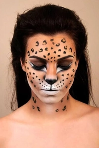 Detail of leopard print face tattoo stickers with gold foil finish for party makeup