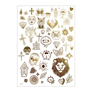Detail of gold metallic temporary tattoos featuring lion, butterfly and moon designs