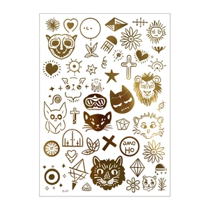Detail of gold metallic tiger and lion temporary tattoos with moon and star patterns