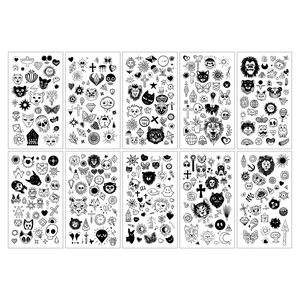 Detail view of 10 sheets of black line temporary tattoos with animal and moon patterns