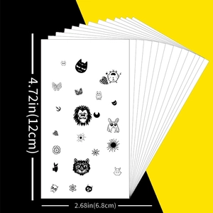Set of temporary black tattoos with lion, cat, moon, and butterfly designs for festivals