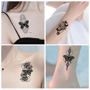 Dark butterfly and floral temporary tattoo stickers in black ink sketch style for arms