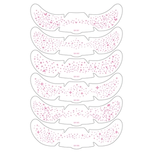 Detailed view of six pink freckle tattoo stickers with hearts and star patterns
