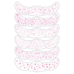 Detail view of 6 pink metallic freckle face stickers with stars and snowflake patterns