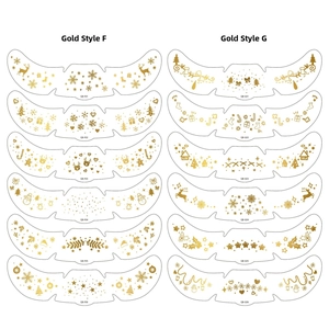 Detail of Christmas gold metallic freckle face tattoos with elk and snowflake patterns