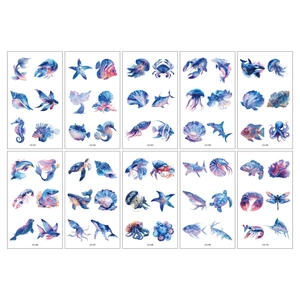 Tatouages temporaires animaux marins aquarelle avec motifs dauphins et baleines bleus