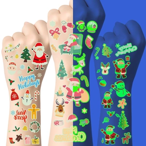 Luminous Christmas tattoo stickers for kids featuring Santa, reindeer and snowman in the dark